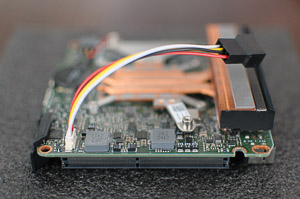 "The fan adapter cable attached to the _NUC_'s motherboard"